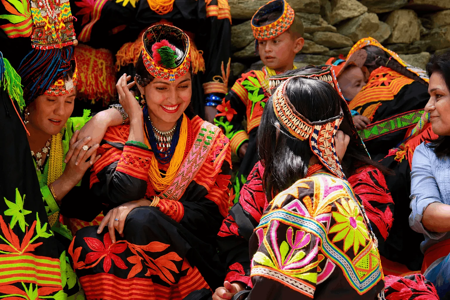 Kalash guide leading visitors through a Birir village